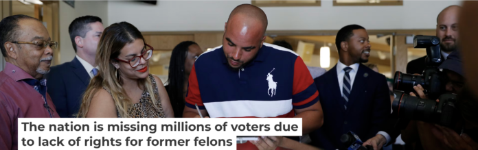 Javon Jackson, center, was able to register to vote following passage of a 2019 Nevada law that restored voting rights to formerly incarcerated individuals. AP Photo/John Locher
